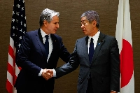 U.S. Secretary of State Antony Blinken shakes hands with Foreign Minister Takeshi Iwaya during a working lunch at a hotel in Tokyo last week. | POOL / via AFP-JIJI