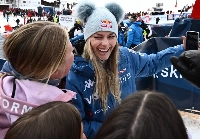 Lindsey Vonn poses for selfies with fans after the women's Super-G in Sankt Anton am Arlberg, Austria, on Sunday. | AFP-JIJI