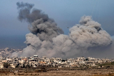 Smoke plumes rise from explosions above destroyed buildings in the northern Gaza Strip on Monday. Smoke plumes rise from explosions above destroyed buildings in the northern Gaza Strip on Monday.