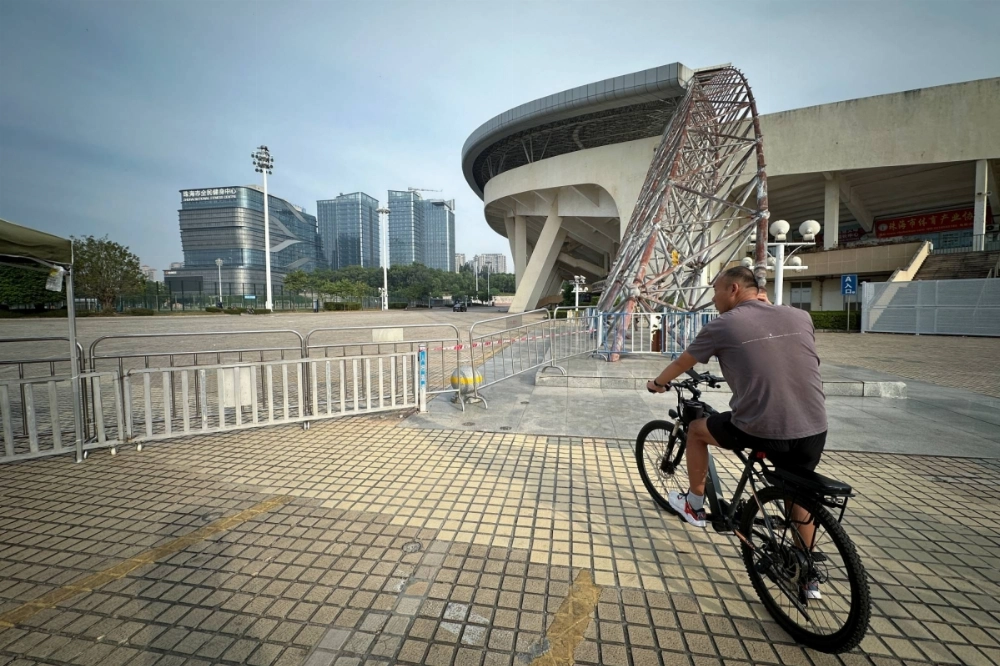 A man stops at a site near a sports center in Zhuhai, Guangdong province, China, where a deadly car attack in November killed 35 people.   A man stops at a site near a sports center in Zhuhai, Guangdong province, China, where a deadly car attack in November killed 35 people.
