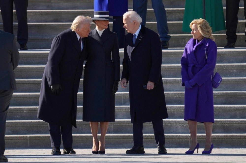 U.S. President Donald Trump and outgoing President Joe Biden, along with their respective first ladies, Melania Trump and Dr. Jill Biden, share words during the Bidens' departure ceremony on the East Front of the Capitol on Monday. U.S. President Donald Trump and outgoing President Joe Biden, along with their respective first ladies, Melania Trump and Dr. Jill Biden, share words during the Bidens' departure ceremony on the East Front of the Capitol on Monday.