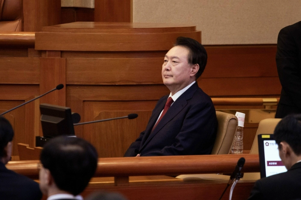 Impeached South Korean President Yoon Suk Yeol attends a hearing at the Constitutional Court of Korea in Seoul on Tuesday. Impeached South Korean President Yoon Suk Yeol attends a hearing at the Constitutional Court of Korea in Seoul on Tuesday.