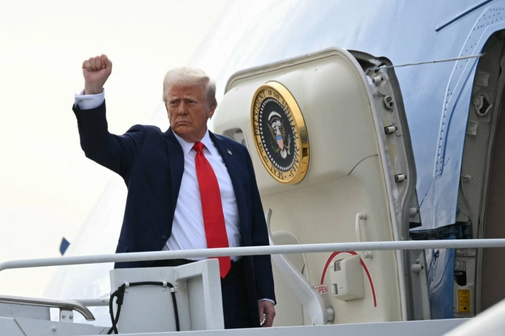 U.S. President Donald Trump boards Air Force One upon departure from Harry Reid International Airport in Las Vegas on Saturday. U.S. President Donald Trump boards Air Force One upon departure from Harry Reid International Airport in Las Vegas on Saturday.