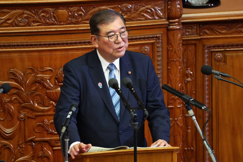 Prime Minister Shigeru Ishiba delivers his policy speech at the Lower House of parliament in Tokyo on Friday. Prime Minister Shigeru Ishiba delivers his policy speech at the Lower House of parliament in Tokyo on Friday.