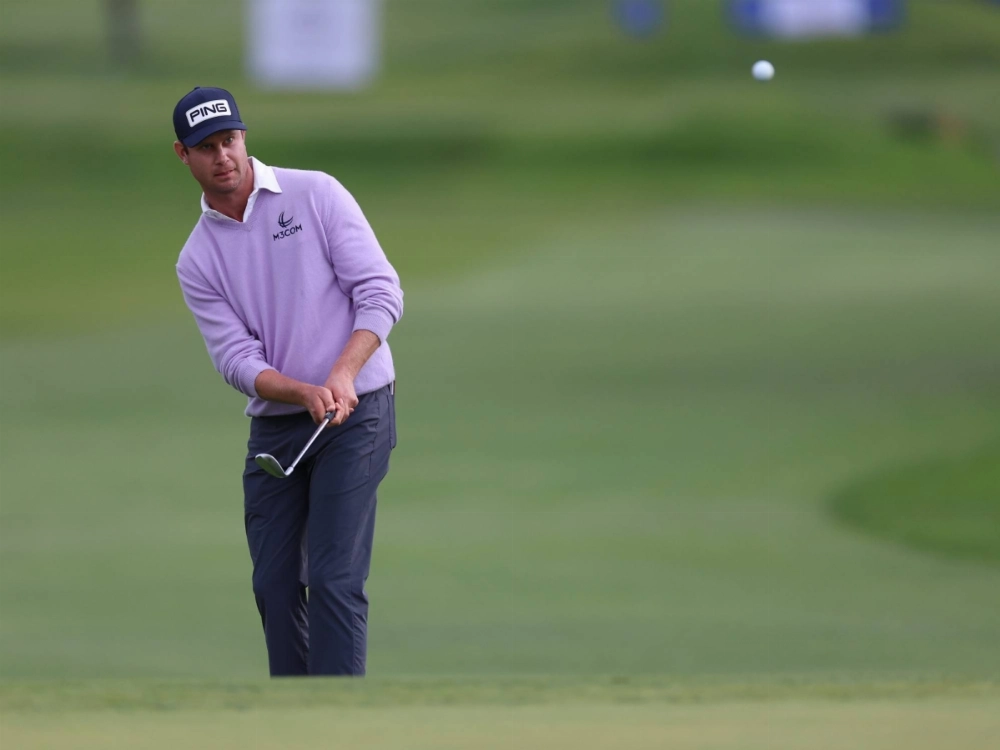 Harris English plays his shot from the fairway on the 15th hole during the final round of the Farmers Insurance Open golf tournament in San Diego, California, on Saturday. Harris English plays his shot from the fairway on the 15th hole during the final round of the Farmers Insurance Open golf tournament in San Diego, California, on Saturday.