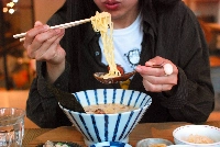 Mumokuteki, a natural lifestyle store with a cafe, serves up soy milk-based ramen on its all-vegan menu at its location on the busy Teramachi shopping street in the city of Kyoto. | Sachi Kitajima Mulkey / Grist