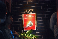 The first guests of the day line up outside the door of Vegan Sushi Tokyo in the Shibuya district. | Sachi Kitajima Mulkey / Grist