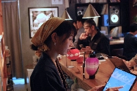 Kazue Maeda, co-founder of Vegan Sushi Tokyo, serves customers at the restaurant, where the recommended lunch set includes a tray of faux-fish sushi.  | Sachi Kitajima Mulkey / Grist