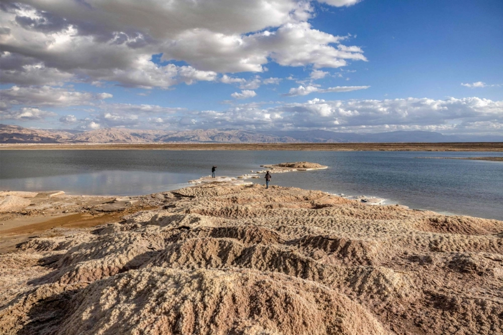 Rock patterns formed by crystalized minerals along the Dead Sea shore near Kibbutz Ein Gedi in eastern Israel on Dec. 30. The Dead Sea, nestled where Israeli, Jordanian and Palestinian territory meet, has famously been dying for years. Rock patterns formed by crystalized minerals along the Dead Sea shore near Kibbutz Ein Gedi in eastern Israel on Dec. 30. The Dead Sea, nestled where Israeli, Jordanian and Palestinian territory meet, has famously been dying for years.