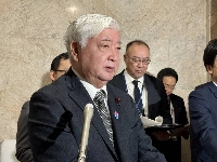 Defense Minister Gen Nakatani speaks to reporters at the parliamentary building on Friday. | Jiji