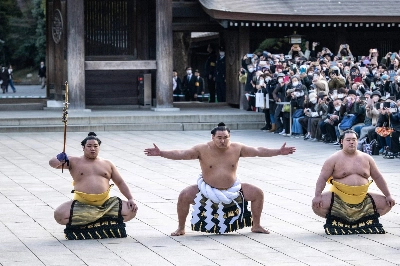 Hoshoryu (center), sumo's newest yokozuna, performs the ring-entrance ceremony at Meiji Shrine in Tokyo on Friday.  Hoshoryu (center), sumo's newest yokozuna, performs the ring-entrance ceremony at Meiji Shrine in Tokyo on Friday.