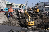 A slope (left) is built at the intersection of a sunken road in Yashio City, Saitama Prefecture on Saturday.  | Jiji