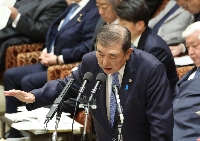 Prime Minister Shigeru Ishiba speaks during a committee meeting in parliament on Monday. | Jiji