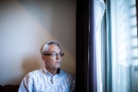 Former Nissan executive Greg Kelly in his Tokyo apartment in February 2020. He returned to the United States after the first verdict nearly three years ago in which he was given a suspended prison sentence. | AFP-Jiji