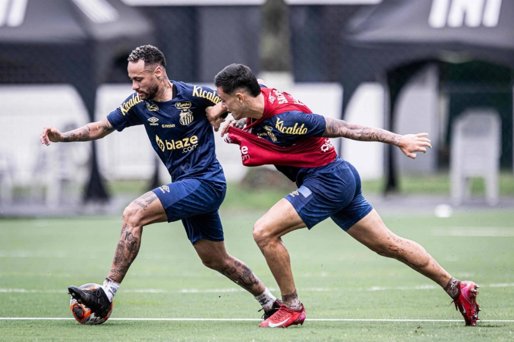 Brazil forward Neymar (left) fights for the ball during a training session at Rei Pele training centre, in Santos, Brazil on Tuesday. Brazil forward Neymar (left) fights for the ball during a training session at Rei Pele training centre, in Santos, Brazil on Tuesday.