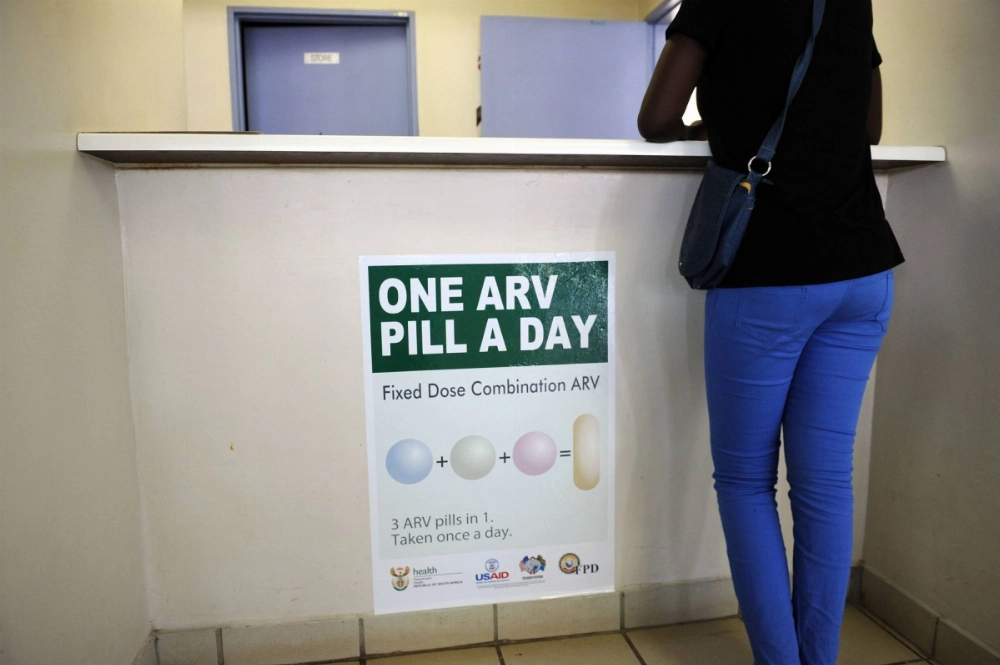 A woman queues at Phedisong clinic on April 8, 2013, during the launch of the new single dose anti-AIDs medication in Ga-Rankuwa, 100 kilometers north of Johannesburg.  A woman queues at Phedisong clinic on April 8, 2013, during the launch of the new single dose anti-AIDs medication in Ga-Rankuwa, 100 kilometers north of Johannesburg.