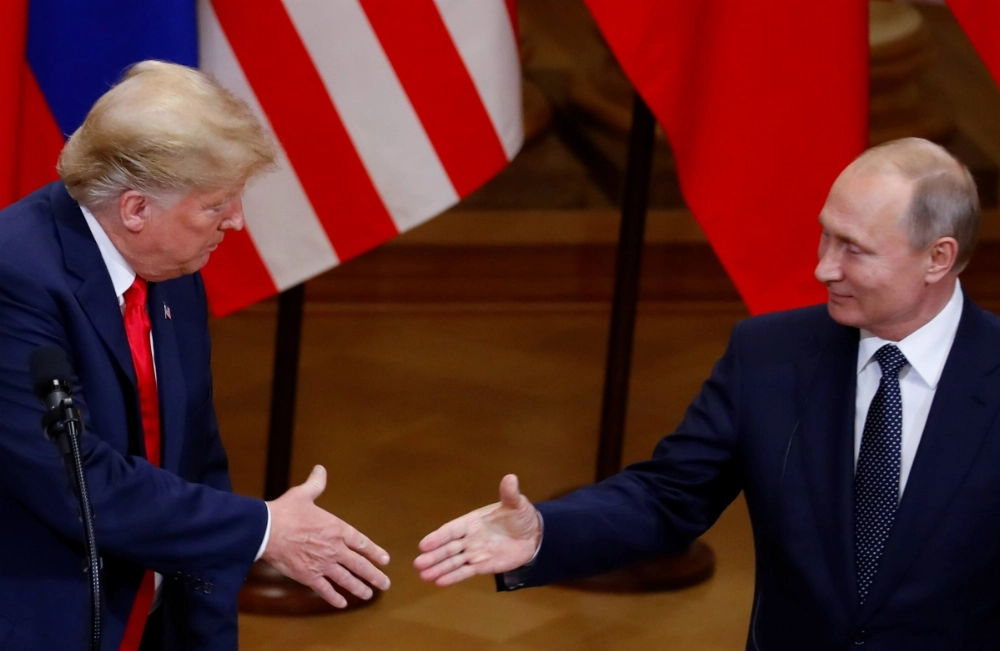 U.S. President Donald Trump and Russian President Vladimir Putin shake hands as they hold a joint news conference after their meeting in Helsinki, Finland, in 2018. U.S. President Donald Trump and Russian President Vladimir Putin shake hands as they hold a joint news conference after their meeting in Helsinki, Finland, in 2018.