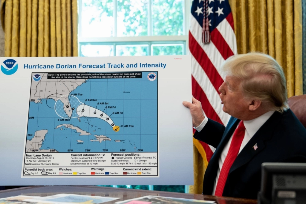 President Donald Trump shows a National Oceanic and Atmospheric Administration (NOAA) forecast track of Hurricane Dorian that was altered with a black marker in Washington on Sept. 4, 2019. President Donald Trump shows a National Oceanic and Atmospheric Administration (NOAA) forecast track of Hurricane Dorian that was altered with a black marker in Washington on Sept. 4, 2019.
