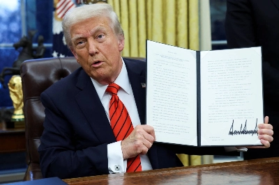 U.S. President Donald Trump holds a signed executive order in the Oval Office of the White House in Washington on Monday. U.S. President Donald Trump holds a signed executive order in the Oval Office of the White House in Washington on Monday.