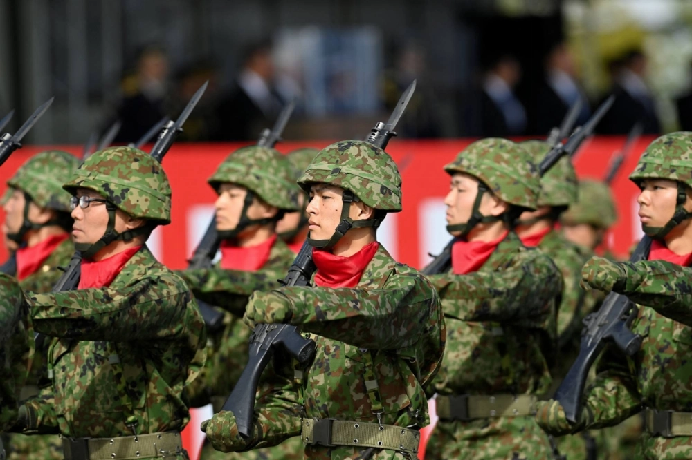 Self-Defense Forces members march in formation at the Ground Self-Defense Force's Camp Asaka, which straddles Tokyo and Saitama Prefectures, last November. Japan has picked the head of its new Joint Operations Command, which is set to be launched on March 24 at the Defense Ministry's headquarters in Tokyo.  Self-Defense Forces members march in formation at the Ground Self-Defense Force's Camp Asaka, which straddles Tokyo and Saitama Prefectures, last November. Japan has picked the head of its new Joint Operations Command, which is set to be launched on March 24 at the Defense Ministry's headquarters in Tokyo.