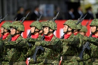 Self-Defense Forces members march in formation at the Ground Self-Defense Force's Camp Asaka, which straddles Tokyo and Saitama Prefectures, last November. Japan has picked the head of its new Joint Operations Command, which is set to be launched on March 24 at the Defense Ministry's headquarters in Tokyo.  | POOL / VIA REUTERS