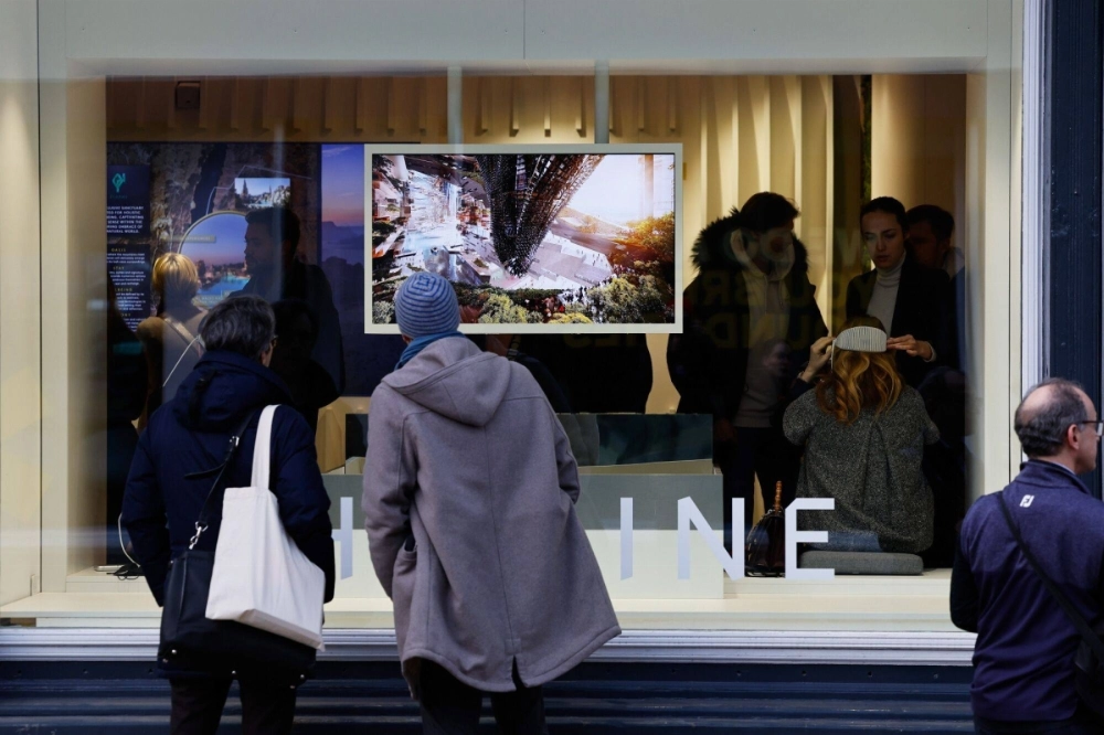 Visitors look at information promoting Saudi Arabia's Neom megaproject at the World Economic Forum in Davos, Switzerland, on Jan. 22. Visitors look at information promoting Saudi Arabia's Neom megaproject at the World Economic Forum in Davos, Switzerland, on Jan. 22.