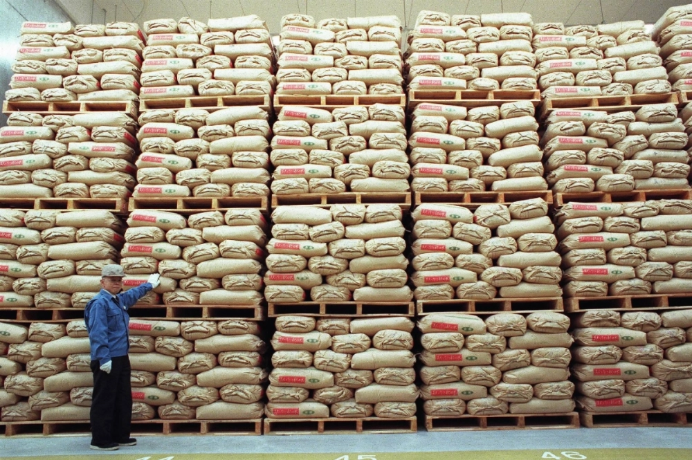 The government's stockpiled rice in Tokyo in 1999. Since 1995, the government has been stockpiling around 200,000 tons of rice from the annual harvest to ensure that there is enough to go around during emergencies.  The government's stockpiled rice in Tokyo in 1999. Since 1995, the government has been stockpiling around 200,000 tons of rice from the annual harvest to ensure that there is enough to go around during emergencies.