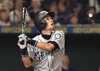 The Seattle Mariners Ichiro Suzuki watches the ball in the top of the third inning against Oakland Athletics during their baseball game at the Major League Baseball Japan Opening Series in Tokyo in March 2019. | AFP-JIJI