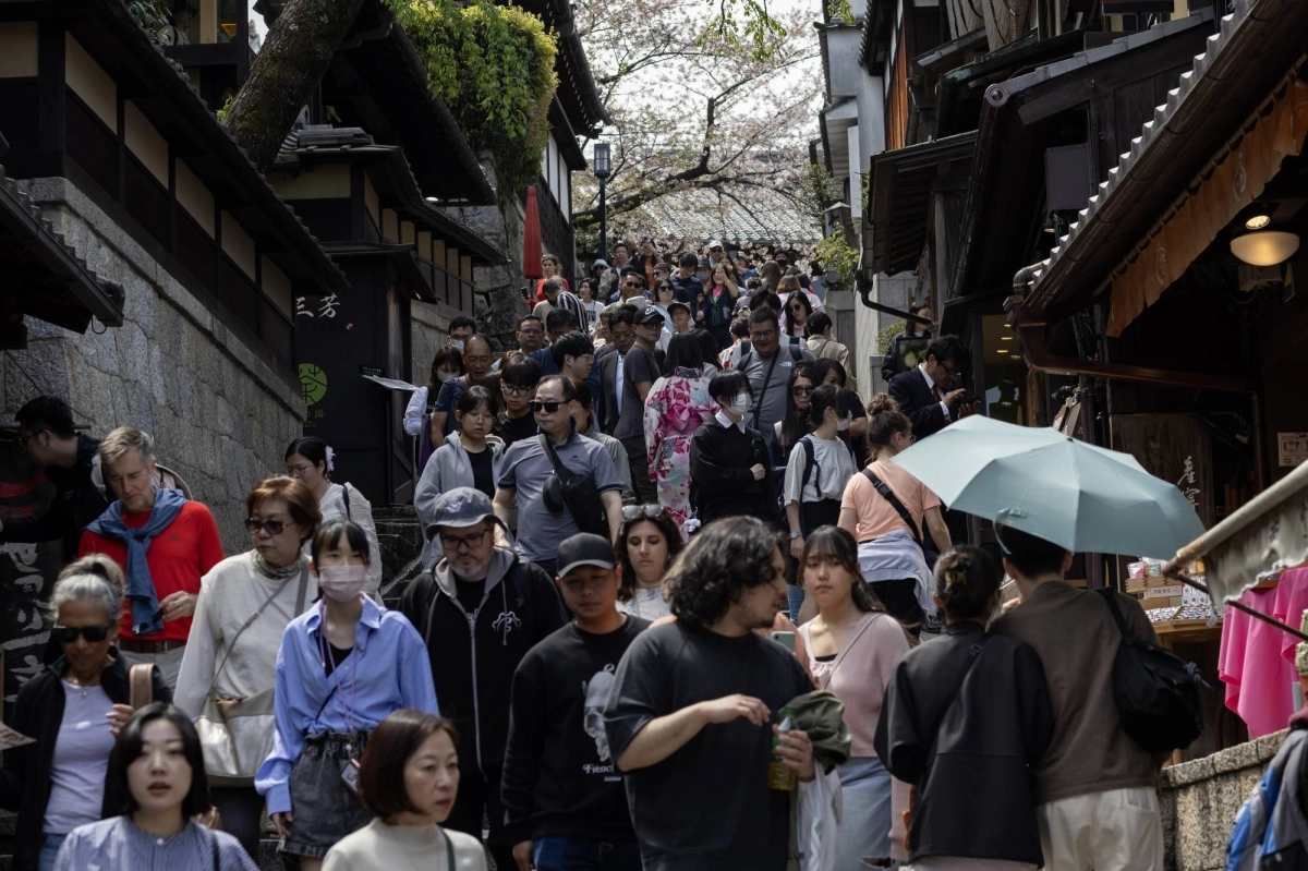 Visitors walk along the Sannenzaka approach in Kyoto in April 2024. Japan is targeting 60 million foreign tourists by 2030, up from a record of almost 37 million last year, highlighting an expected growth in flights — and aviation's carbon emissions. Visitors walk along the Sannenzaka approach in Kyoto in April 2024. Japan is targeting 60 million foreign tourists by 2030, up from a record of almost 37 million last year, highlighting an expected growth in flights — and aviation's carbon emissions.