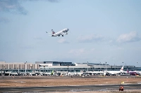 A JAL aircraft takes off from New Chitose Airport in Chitose, Hokkaido, in December 2023. Slow progress in many areas shows just how challenging decarbonization is for the aviation sector. | Bloomberg