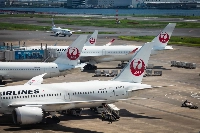 JAL aircraft at Haneda Airport in August 2024. Aviation comprises just over half of global tourism emissions even before considering warming effects from things other than carbon dioxide. | Bloomberg