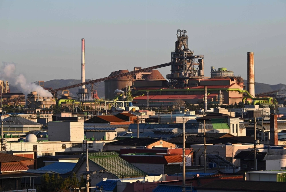Steelworks of South Korea's largest steelmaker POSCO are seen over a residential area in Pohang on Feb. 13. Smoke billows from chimneys as factories churn in South Korea's steelmaking heartland, now under threat from Washington's new tariffs on the port city's largest export. Steelworks of South Korea's largest steelmaker POSCO are seen over a residential area in Pohang on Feb. 13. Smoke billows from chimneys as factories churn in South Korea's steelmaking heartland, now under threat from Washington's new tariffs on the port city's largest export.