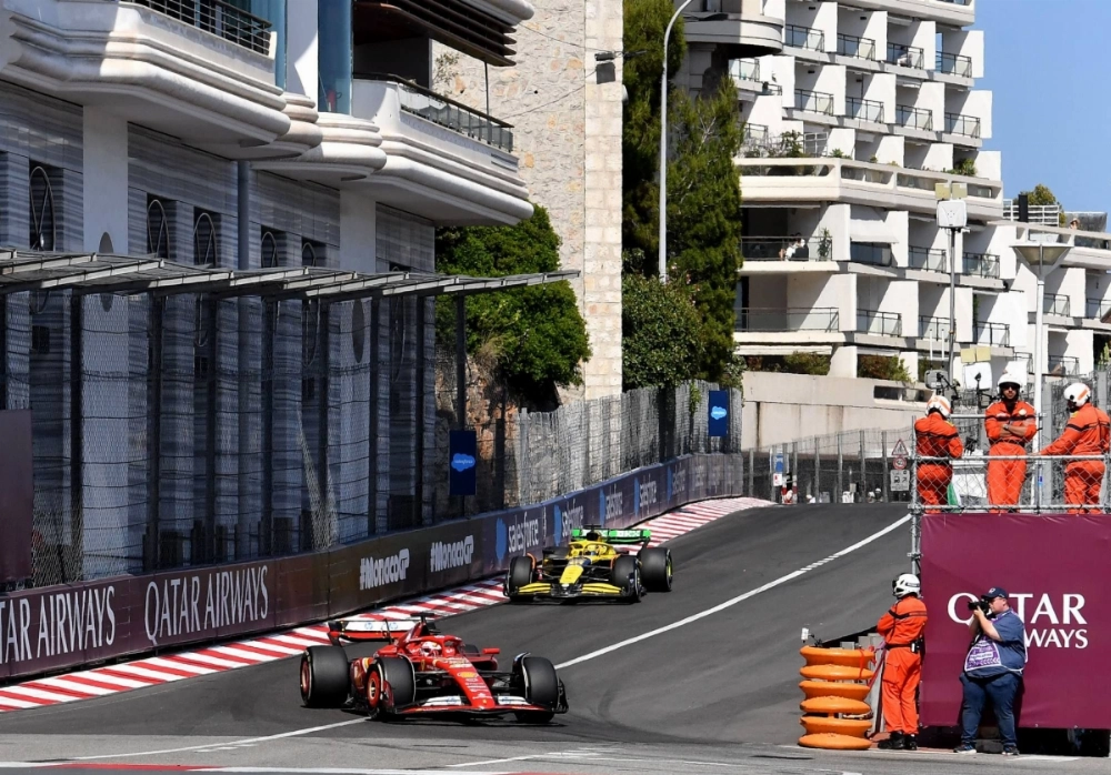 Ferrari's Charles Leclerc and McLaren's Oscar Piastri in action during the Monaco Grand Prix on May 26, 2024 Ferrari's Charles Leclerc and McLaren's Oscar Piastri in action during the Monaco Grand Prix on May 26, 2024