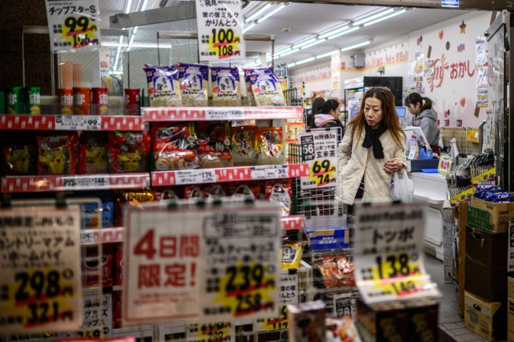 A customer visits a store along the Togoshi Ginza shopping street in Tokyo on Jan. 23. Rising fresh food prices contributed to the acceleration in overall inflation in January, as vegetable prices, including cabbage, soared. A customer visits a store along the Togoshi Ginza shopping street in Tokyo on Jan. 23. Rising fresh food prices contributed to the acceleration in overall inflation in January, as vegetable prices, including cabbage, soared.