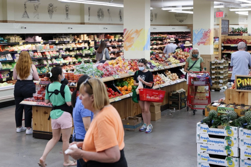 People shop in a supermarket as inflation affected consumer prices in Manhattan, New York City, in June 2022. People shop in a supermarket as inflation affected consumer prices in Manhattan, New York City, in June 2022.
