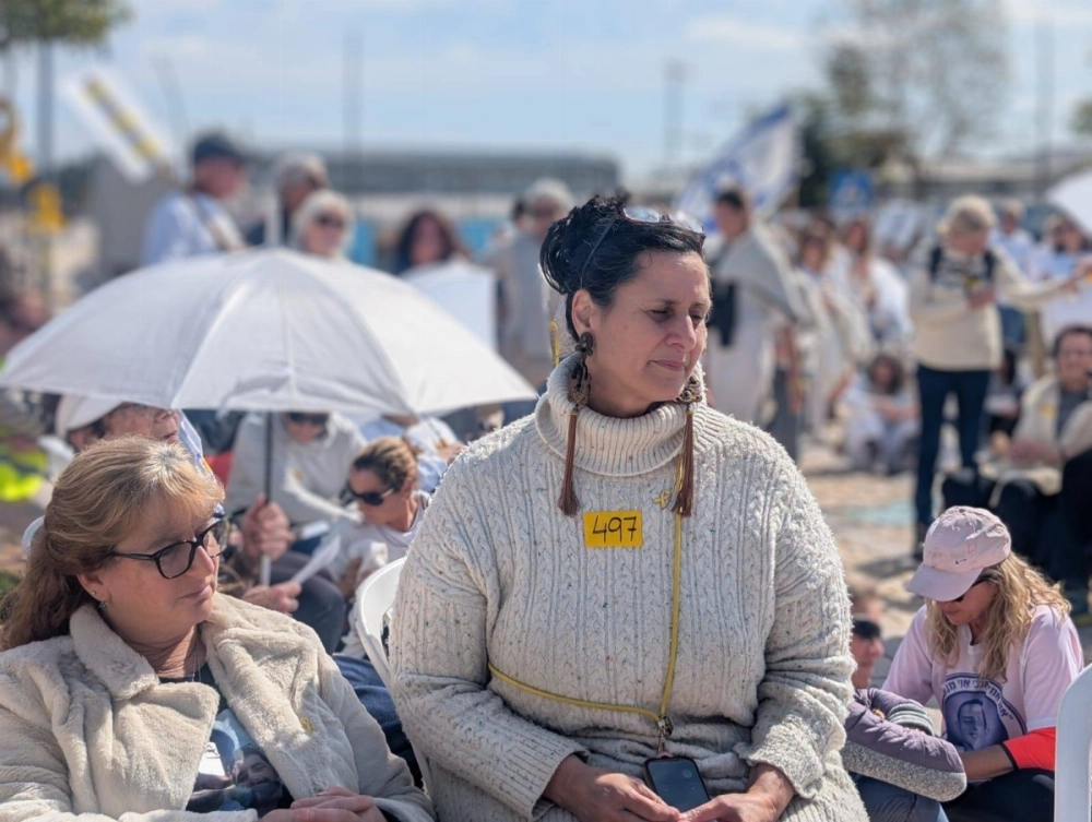 Efrat Machikawa (center) and others protest in white near the Knesset in Jerusalem on Feb. 14, advocating for the safe return of hostages held by Hamas in the Gaza Strip. Efrat Machikawa (center) and others protest in white near the Knesset in Jerusalem on Feb. 14, advocating for the safe return of hostages held by Hamas in the Gaza Strip.
