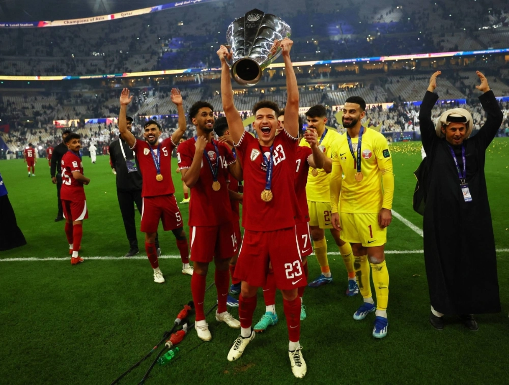 Qatar's Moustafa Tarek celebrates with the trophy after his team defeated Jordan to win the AFC Asian Cup in Lusail, Qatar, on Feb. 10, 2024. Qatar's Moustafa Tarek celebrates with the trophy after his team defeated Jordan to win the AFC Asian Cup in Lusail, Qatar, on Feb. 10, 2024.