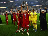 Qatar's Moustafa Tarek celebrates with the trophy after his team defeated Jordan to win the AFC Asian Cup in Lusail, Qatar, on Feb. 10, 2024. | REUTERS