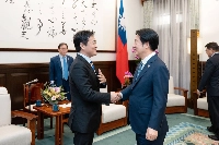 Yuichiro Tamaki, chief of Democratic Party for the People (left), meets with Taiwanese President Lai Ching-te at the presidential office in Taipei on Monday. | Taiwan Presidential Office / via Jiji