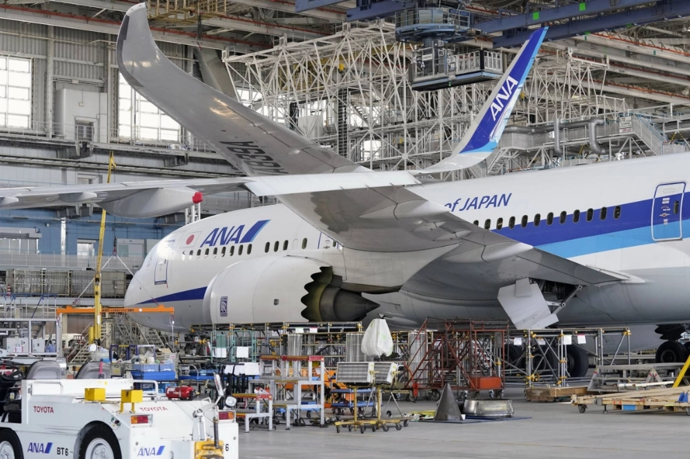 An ANA Boeing 787 Dreamliner undergoes maintenance in ANA's hanger at Haneda Airport. An ANA Boeing 787 Dreamliner undergoes maintenance in ANA's hanger at Haneda Airport.