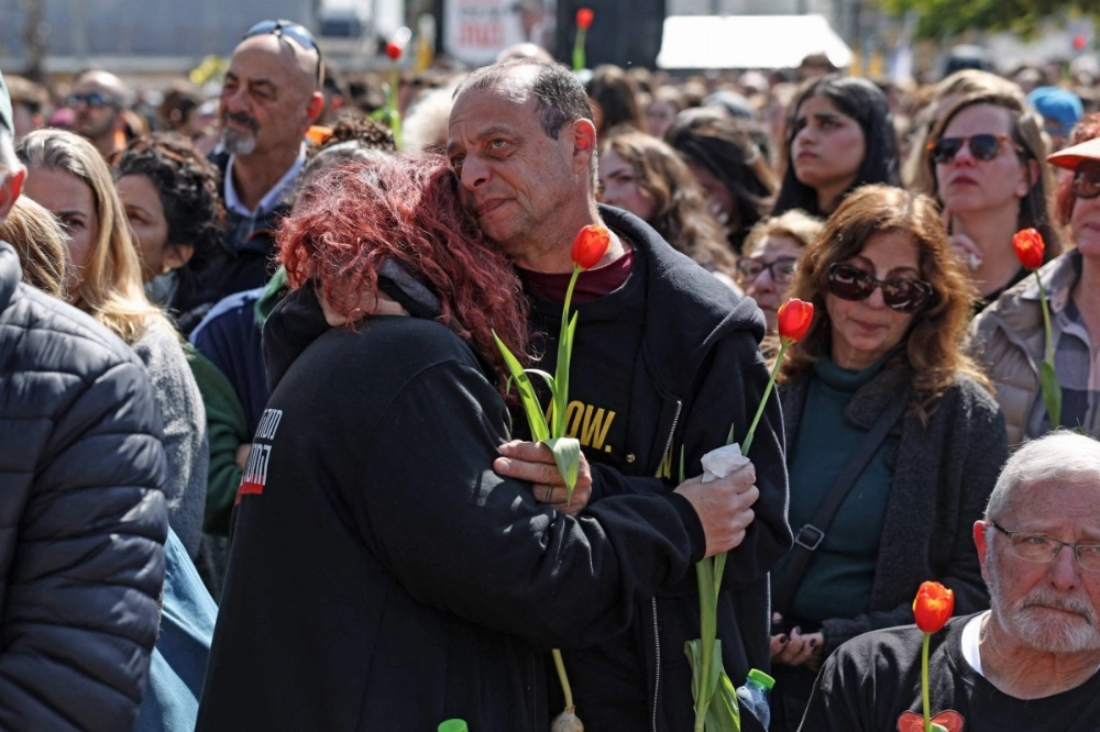 Thousands of mourners, carrying flags and orange balloons, joined a funeral procession on Wednesday for Shiri Bibas and her two sons, who were among the hostages taken by Palestinian militants in Gaza in October 2023 and who died during their captivity. Thousands of mourners, carrying flags and orange balloons, joined a funeral procession on Wednesday for Shiri Bibas and her two sons, who were among the hostages taken by Palestinian militants in Gaza in October 2023 and who died during their captivity.