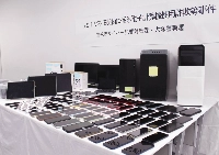 The computers and smartphones seized by the Metropolitan Police Department on Thursday in Tokyo's Bunkyo Ward | Jiji