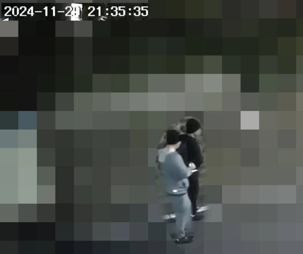 Security footage provided by a neighbor shows two men walking near the scene of the burglary in Tokyo's Nerima Ward a few hours beforehand. The surroundings have been blurred for privacy reasons. Security footage provided by a neighbor shows two men walking near the scene of the burglary in Tokyo's Nerima Ward a few hours beforehand. The surroundings have been blurred for privacy reasons.