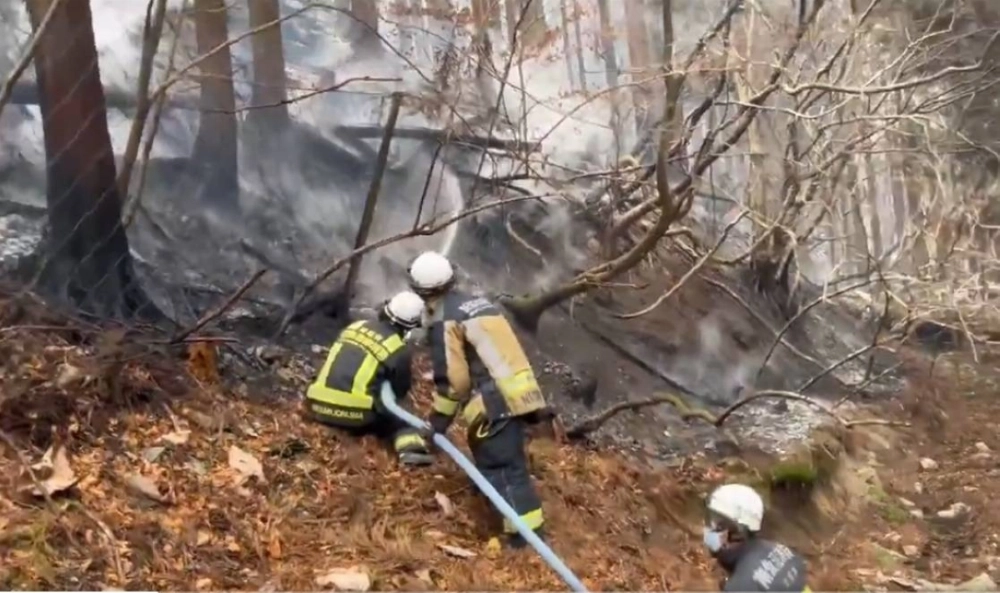 Firefighters work to extinguish the forest fire in the city of Ofunato, Iwate Prefecture, in this screenshot of a video footage from the Fire and Disaster Management Agency on Friday. Firefighters work to extinguish the forest fire in the city of Ofunato, Iwate Prefecture, in this screenshot of a video footage from the Fire and Disaster Management Agency on Friday.