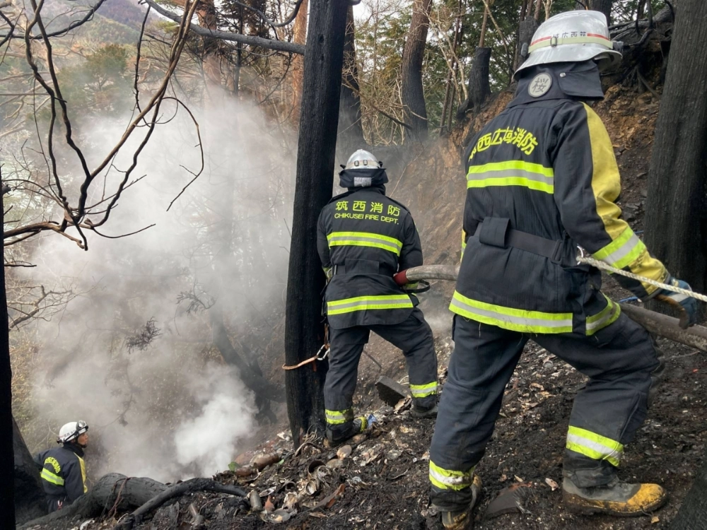 Firefighters battle a wildfire in Ofunato, Iwate Prefecture, on Thursday. Firefighters battle a wildfire in Ofunato, Iwate Prefecture, on Thursday.
