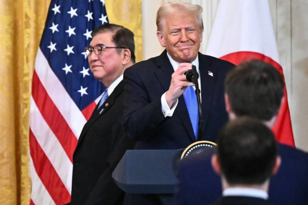 Prime Minister Shigeru Ishiba (left) and U.S. President Donald Trump arrive for a joint news conference in the East Room of the White House in Washington, on Feb. 7. Prime Minister Shigeru Ishiba (left) and U.S. President Donald Trump arrive for a joint news conference in the East Room of the White House in Washington, on Feb. 7.