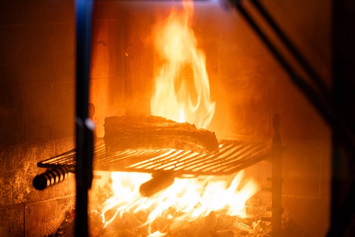 The focus of chef Yusuke Takeuchi’s open kitchen — and his meat-centric cuisine — is his wood-fired grill. The focus of chef Yusuke Takeuchi’s open kitchen — and his meat-centric cuisine — is his wood-fired grill.