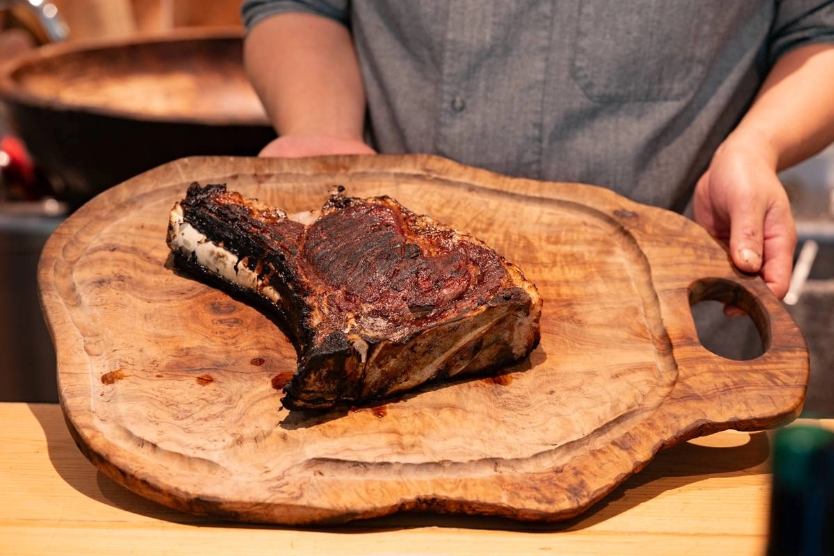 Chef Yusuke Takeuchi’s signature dish is his on-bone 'bistecca alla Fiorentina' (Florentine steak), which he prepares from local Akagi-gyu beef aged around 60 days. Chef Yusuke Takeuchi’s signature dish is his on-bone 'bistecca alla Fiorentina' (Florentine steak), which he prepares from local Akagi-gyu beef aged around 60 days.