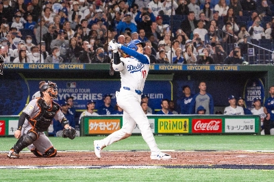 Shohei Ohtani launches a home run in the third inning of the Dodgers' exhibition win over the Giants at Tokyo Dome on Saturday.  Shohei Ohtani launches a home run in the third inning of the Dodgers' exhibition win over the Giants at Tokyo Dome on Saturday.