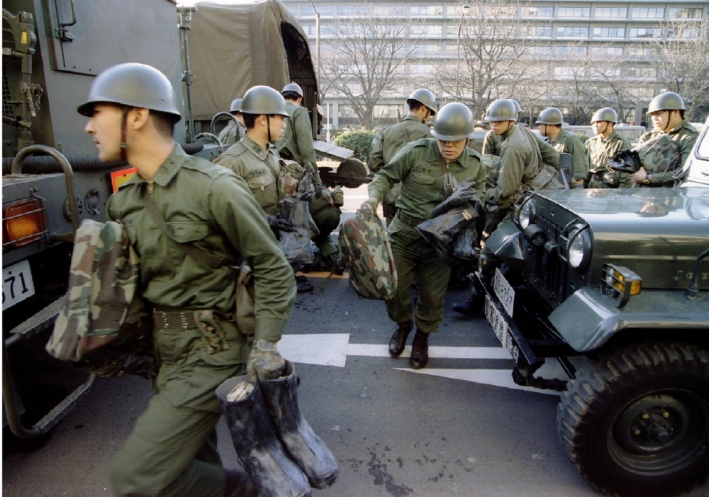Japanese soldiers prepare to go underground amid a sarin gas attack in the Tokyo subway system on March 20, 1995.  Japanese soldiers prepare to go underground amid a sarin gas attack in the Tokyo subway system on March 20, 1995.